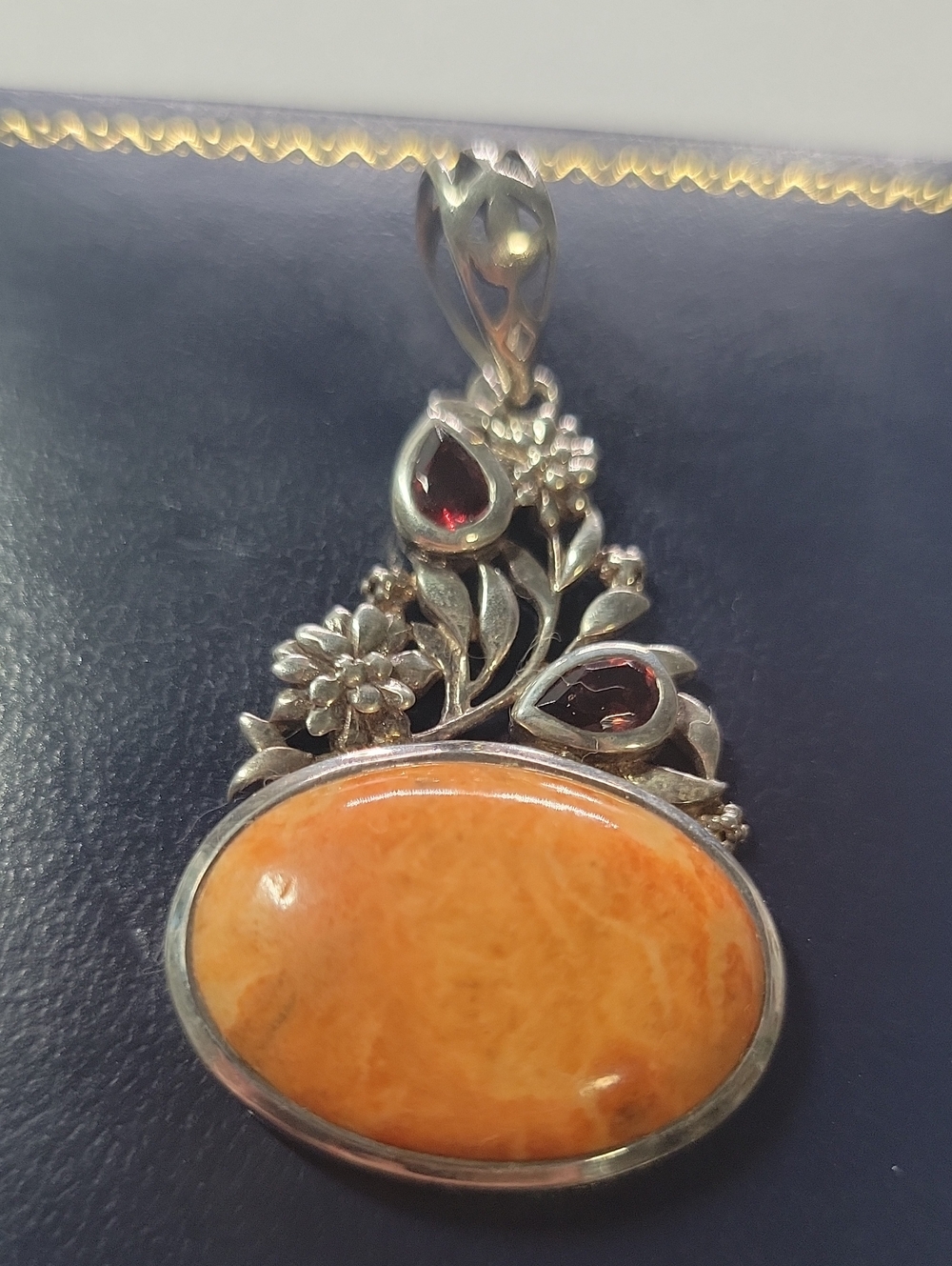 Sterling Silver Orange Stone Floral Pendant with Garnet Accents